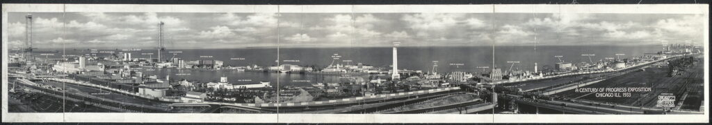 Wide view of the exposition buildings and lagoons. The architecture appears as a coherent, manufactured future rather than a collection of isolated exhibits.
